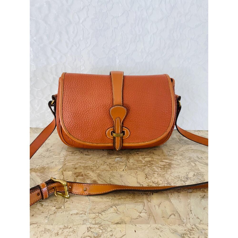 Vtg DOONEY and BOURKE AWL burn orange saddle round small shoulder bag crossbody